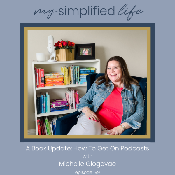 Michelle Glogovac sitting in a chair with a bookshelf of books behind her and a podcast microphone on top.